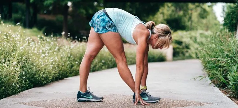 Woman stretching for staying safe during the move