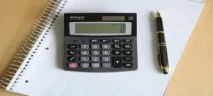 a pen, notebook and a calculator