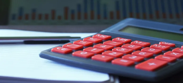 red-buttoned calculator