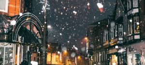 Snow falling in the city at night
