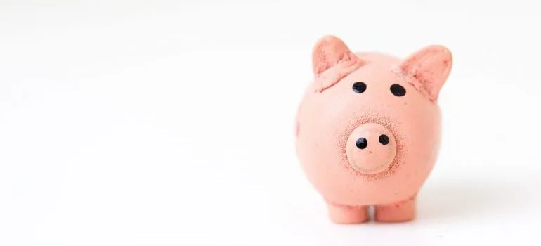 A piggy bank with saved money when moving out of NJ