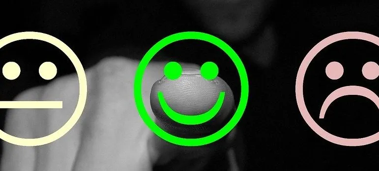 A man pointing out to a positive review