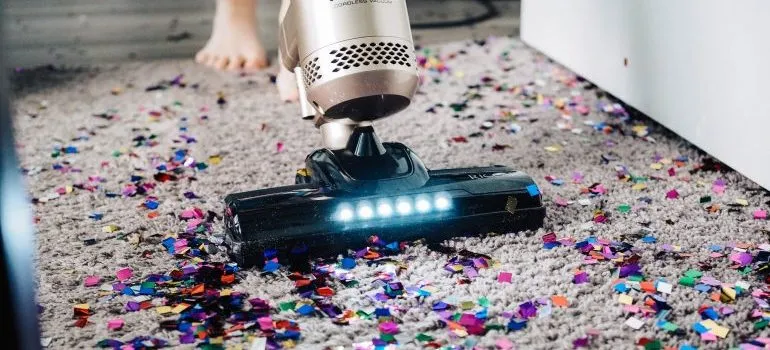 Vacuuming after a housewarming party that needs to be on the post-move checklist