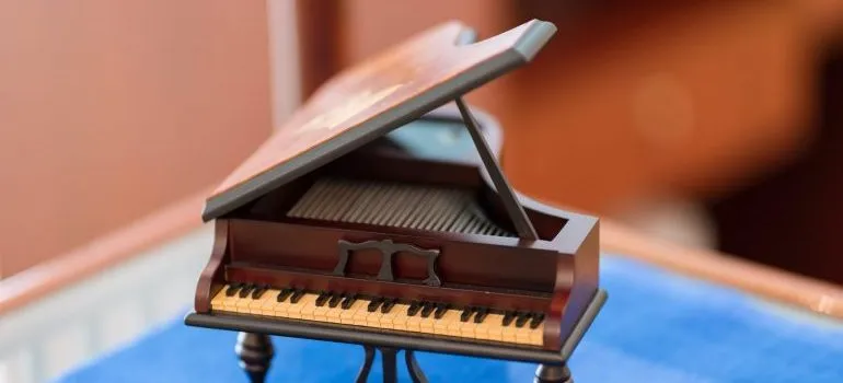 Model of a piano showing size and shape that represent challenges of moving your piano in NJ