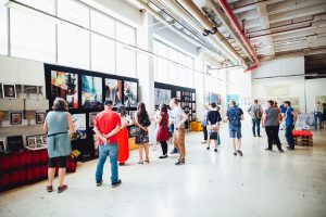 People in a gallery on an art exhibition