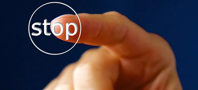 pointing at stop sign