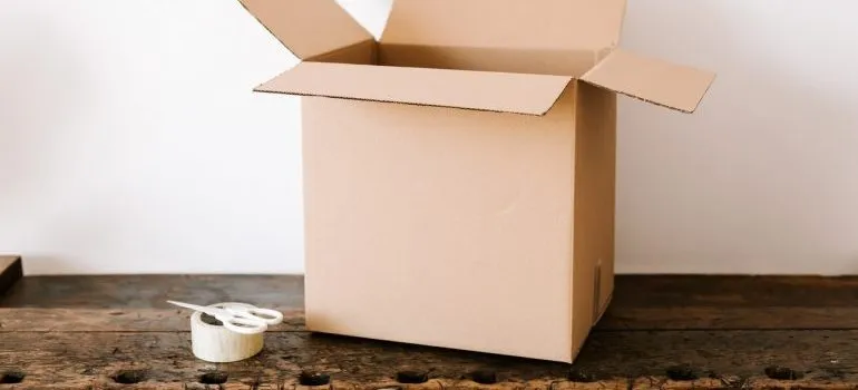 box, tape and scissors