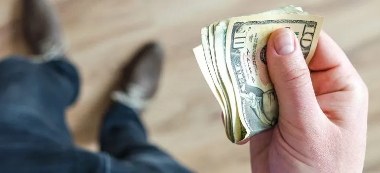 man holding money in his hand
