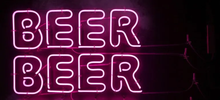 Neon sign with the word beer written three times