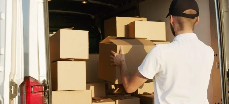 A mover loading a moving truck