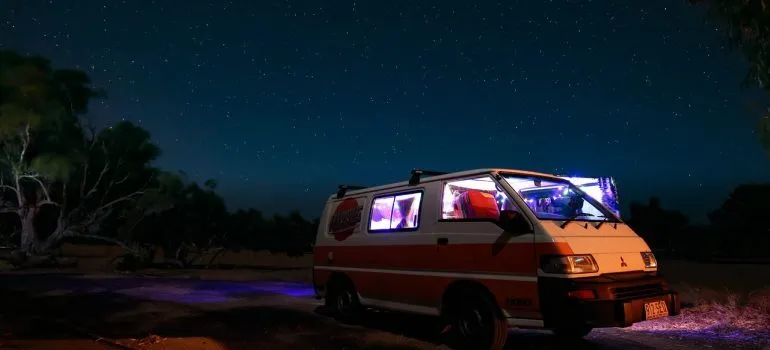 Family camper and a beautiful night sky in the background