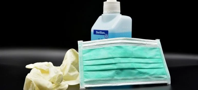 a disinfectant with a mask and gloves