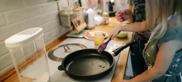 Daughter helping her mom cook