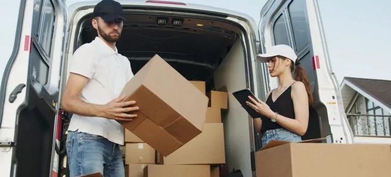 Movers unloading boxes