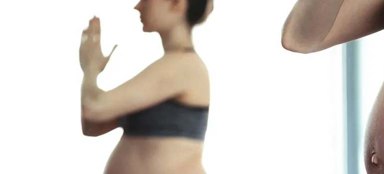 a pregnant lady doing yoga