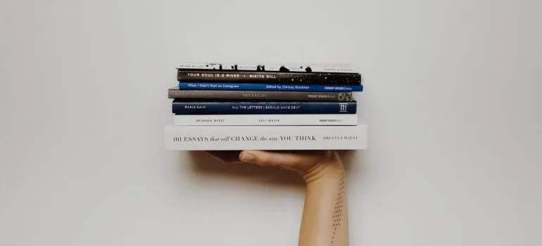 person holding books