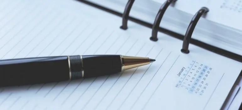 notebook with a pen