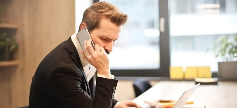 A man calling his movers to file a complaint and get out of a bad moving contract