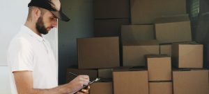 Picture of a moving professional. The easiest way to organize the unpacking process is to call reliable moving partners