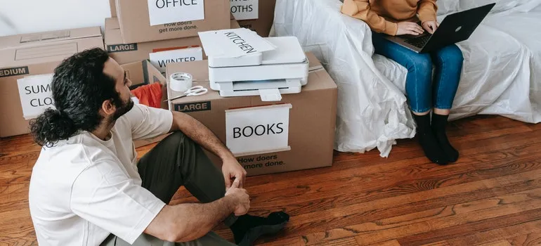 Man and woman packing items