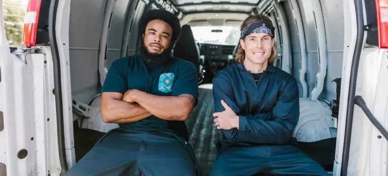 Two man sitting in a van.