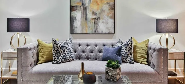 grey sofa bed with colorful pillows