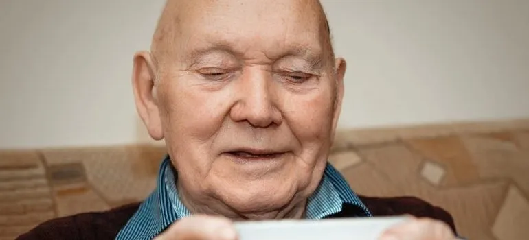 senior man looking at the phone