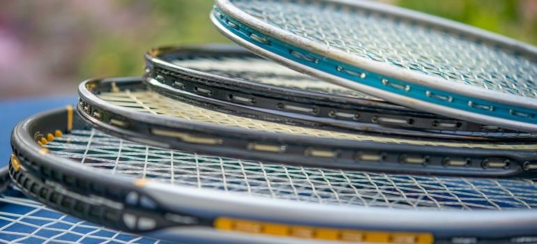tennis rackets stacked