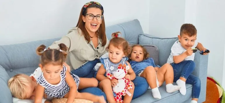 a woman sitting with children