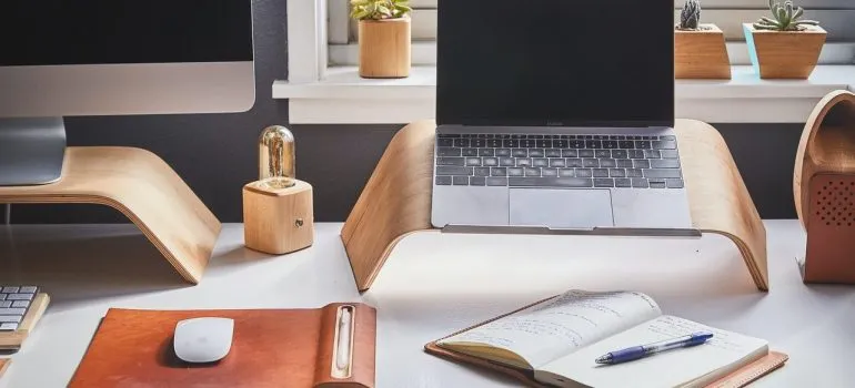 a laptop next to a PC in a home office