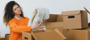 A woman packing for the move