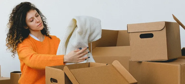 A woman packing for the move