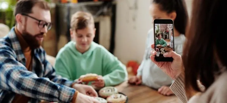 Woman taking picture of her family