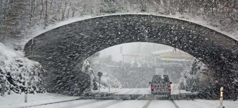 Vehicle crossing a tunnel in winter