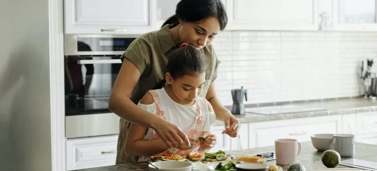 Mother and daughter cooking dinner