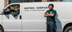 a man standing in front of a moving van
